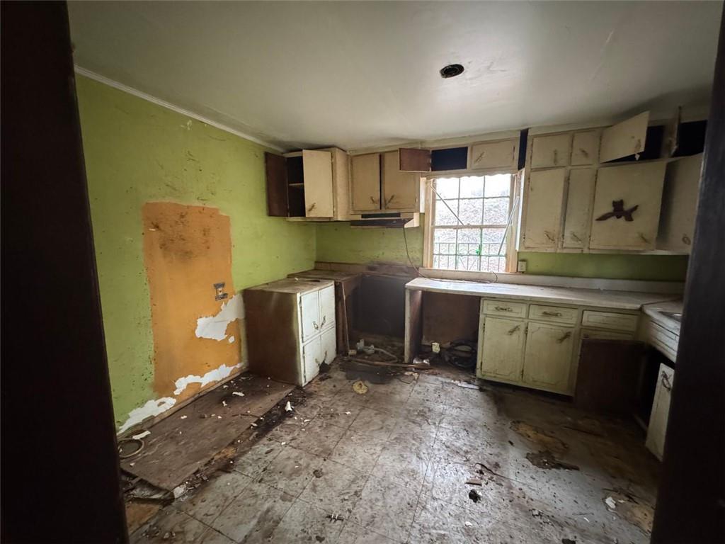 1096 3rd Street Northwest Atlanta, GA 30318 - Photo 12 of 17 a utility room with a sink a washer and dryer