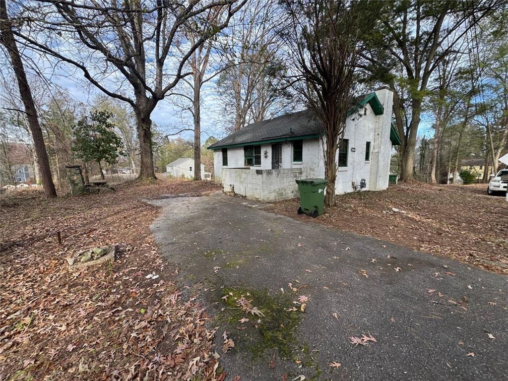 1096 3rd Street Northwest Atlanta, GA 30318 - Photo 2 of 17 a view of a house with a yard