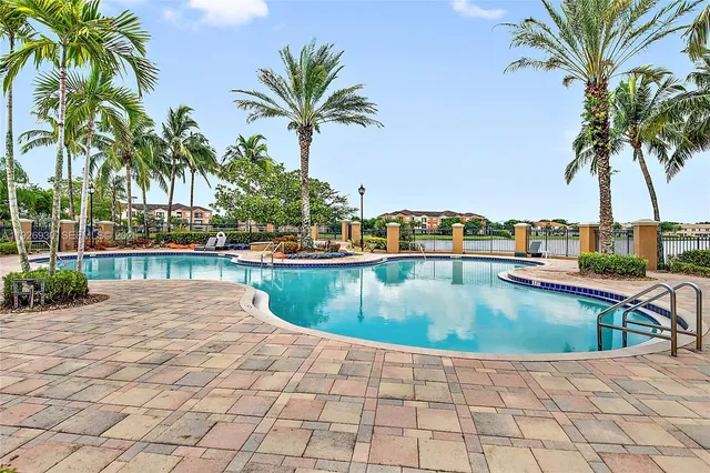 a view of a swimming pool and a chair