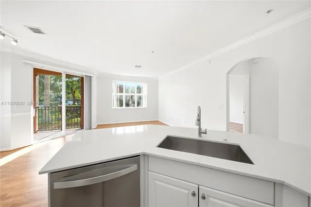 a kitchen with a sink and a window
