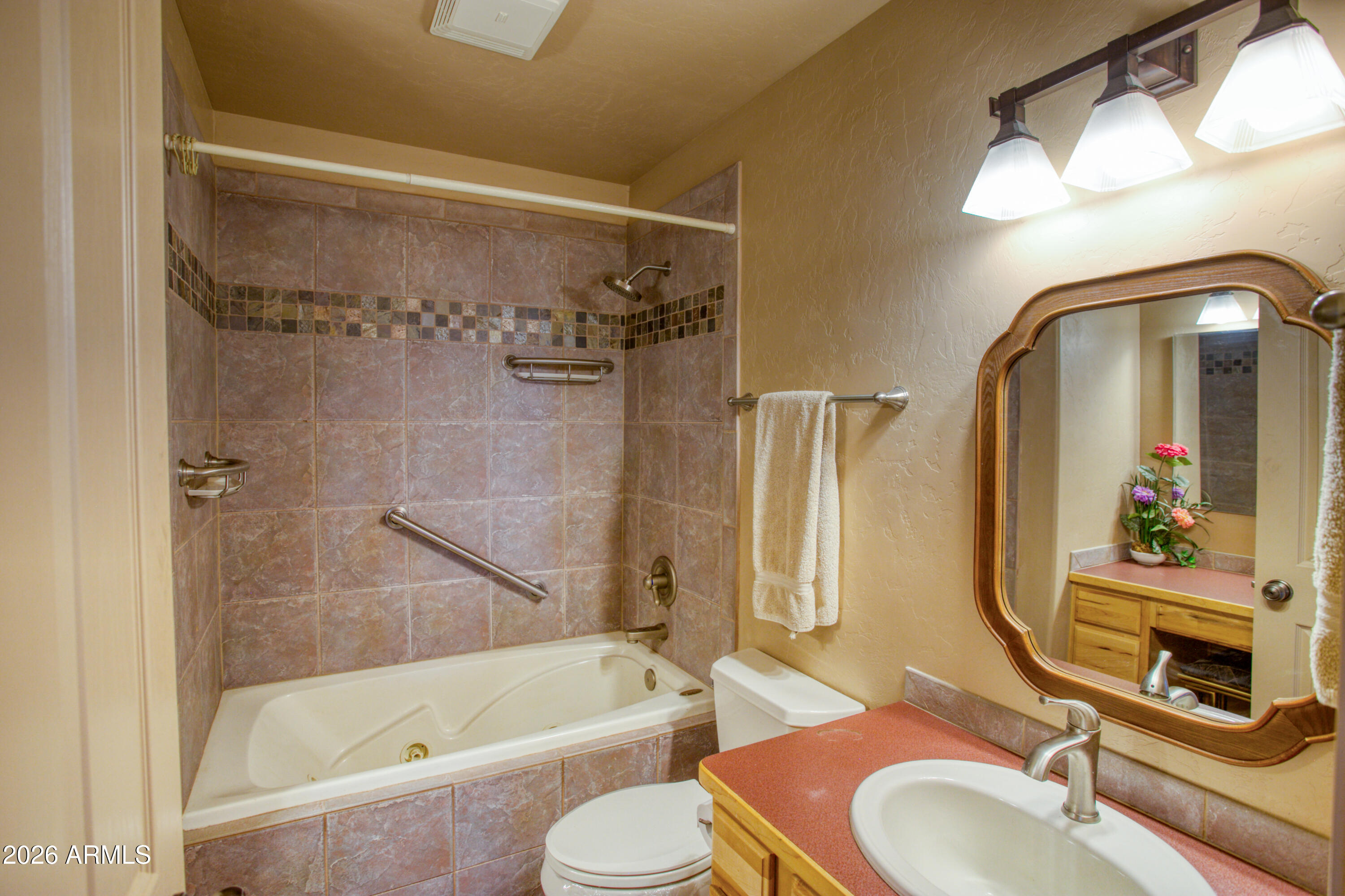 1511 South Canyon Ridge Trail Show Low, AZ 85901 - Photo 32 of 61 a bathroom with a sink toilet and shower