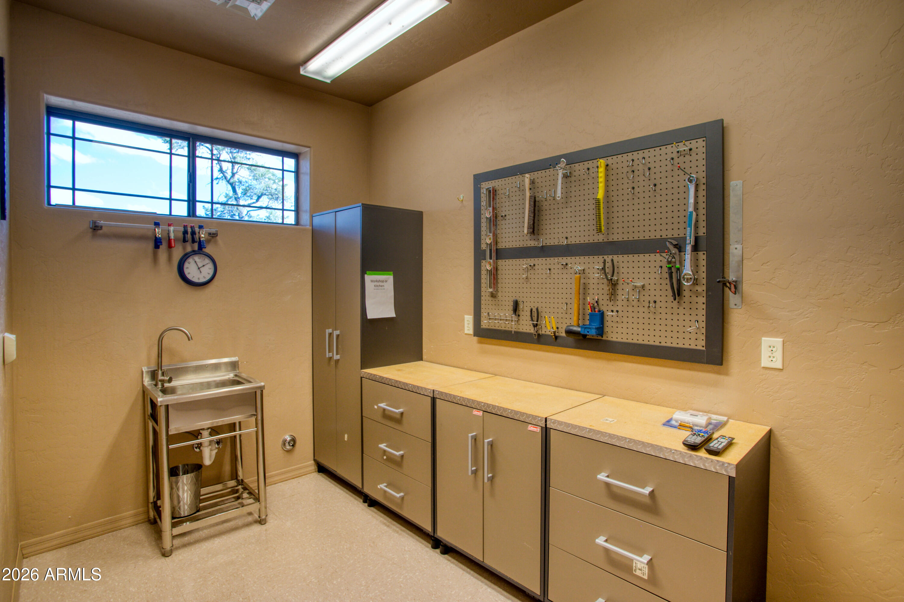 1511 South Canyon Ridge Trail Show Low, AZ 85901 - Photo 38 of 61 a room with a window and a dresser