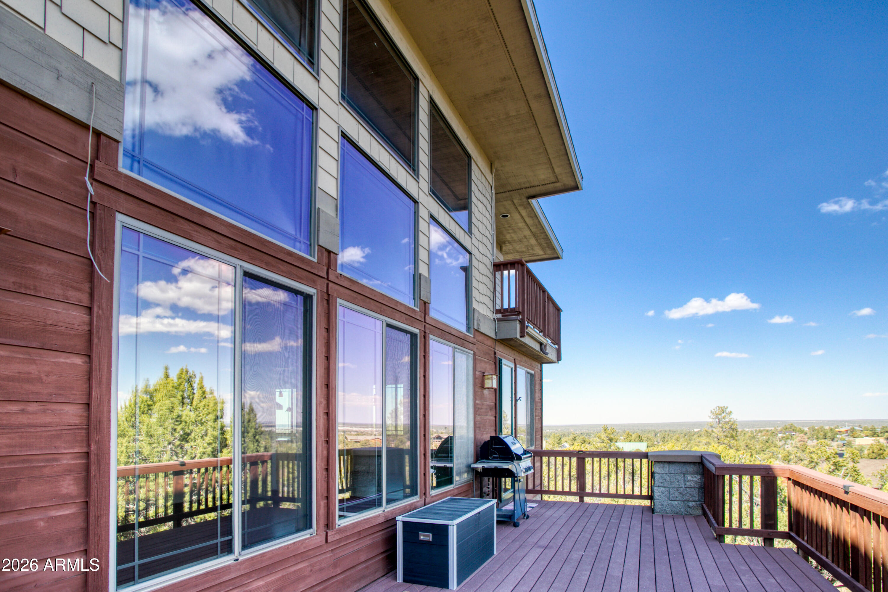 1511 South Canyon Ridge Trail Show Low, AZ 85901 - Photo 51 of 61 a view of a patio with wooden floor and iron stairs