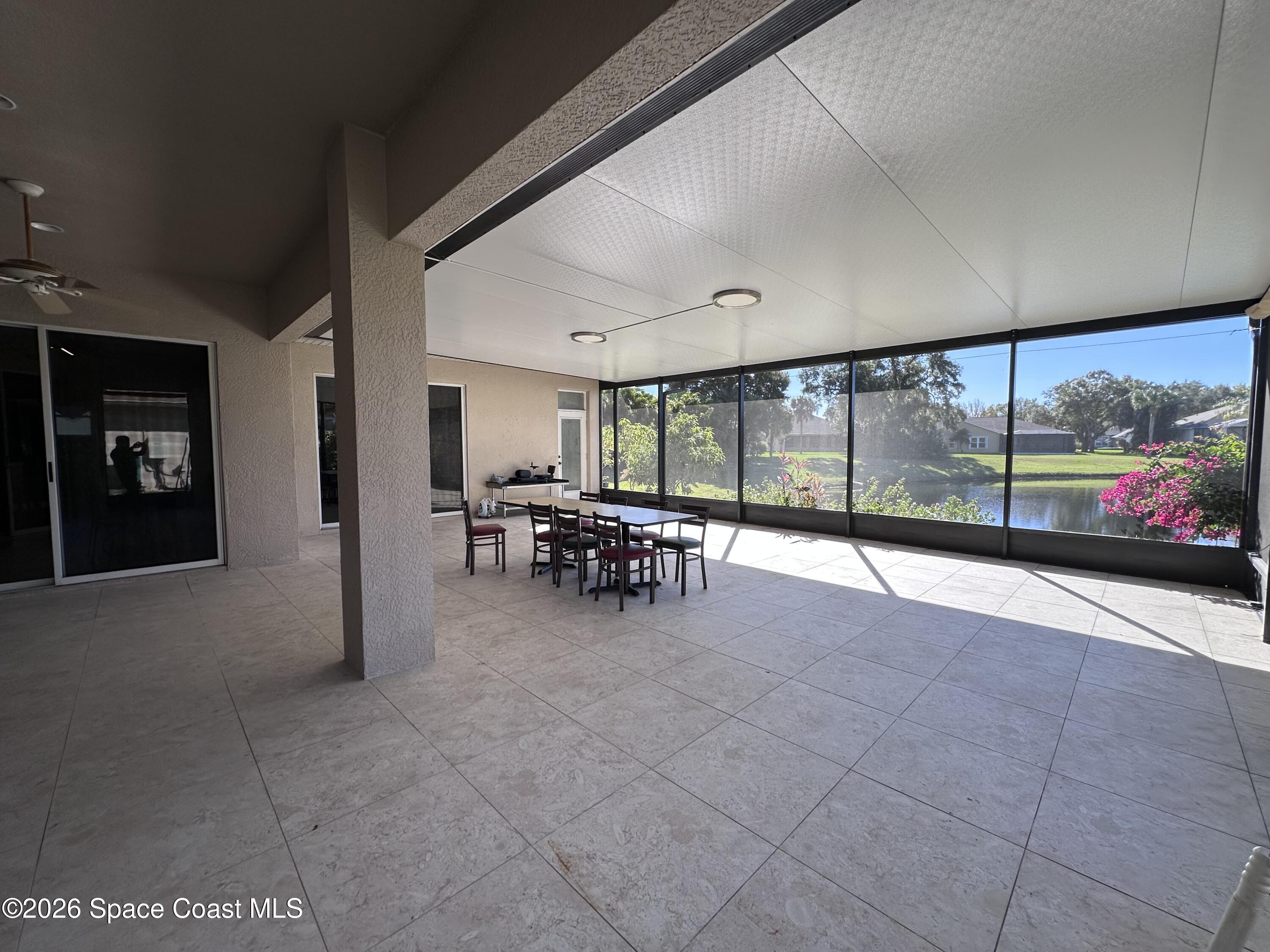 883 Spring Oak Drive Melbourne, FL 32901 - Photo 16 of 43 a view of a lobby with furniture and floor to ceiling window