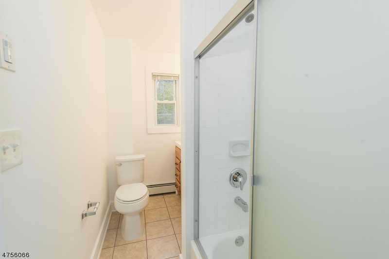 55 Madison Street, Unit 3 Newton, NJ 07860 - Photo 11 of 15 a bathroom with a toilet and a shower