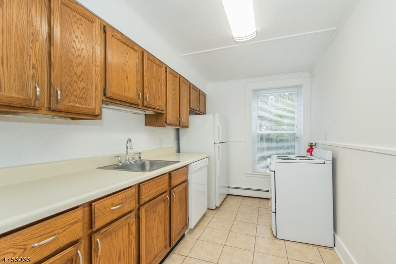55 Madison Street, Unit 3 Newton, NJ 07860 - Photo 3 of 15 a kitchen with a sink cabinets and utility