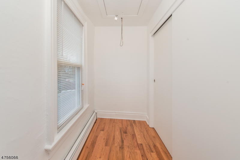 55 Madison Street, Unit 3 Newton, NJ 07860 - Photo 9 of 15 a view of a room with wooden floor and white walls