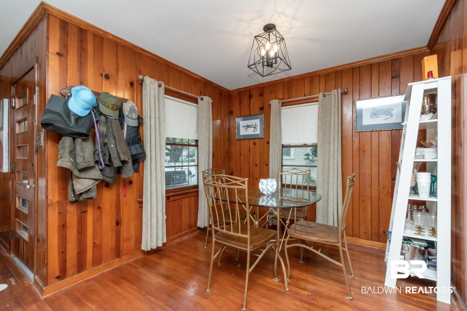 20 Kirby Street Mobile, AL 36607 - Photo 10 of 35 Dining room with a notable chandelier, wood-type flooring, crown molding, and wooden walls