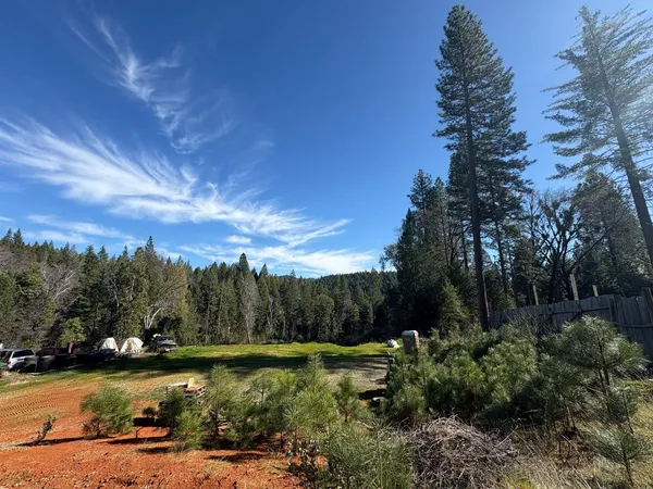 a view of a lake with a yard