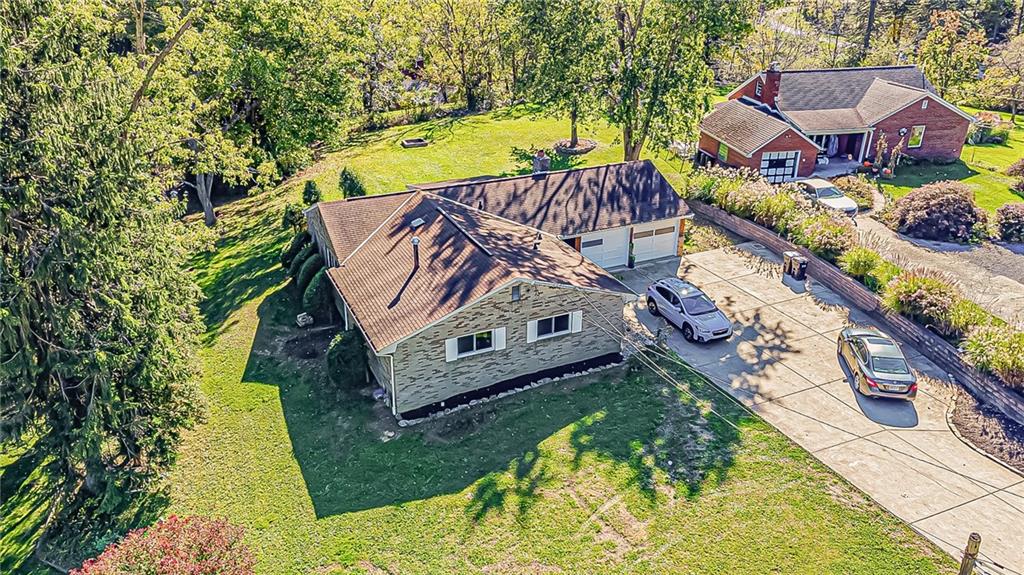 1858 Sample Road Allison Park, PA 15101 - Photo 2 of 25 an aerial view of a house with a garden and swimming pool