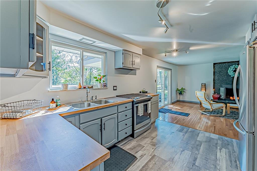 1858 Sample Road Allison Park, PA 15101 - Photo 13 of 25 a kitchen that has a sink and a view of living room