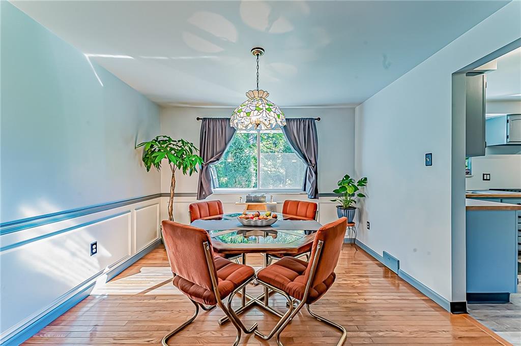1858 Sample Road Allison Park, PA 15101 - Photo 14 of 25 a outdoor dining room with furniture window and wooden floor
