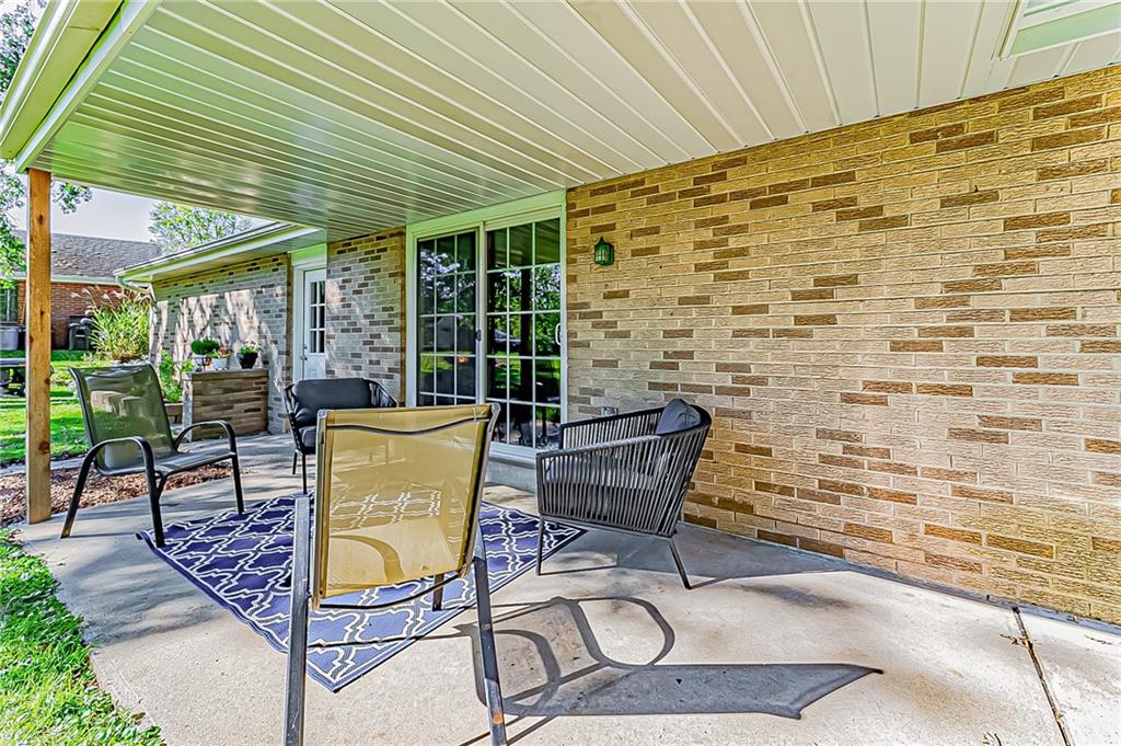 1858 Sample Road Allison Park, PA 15101 - Photo 4 of 25 a view of a patio with table and chairs and potted plants