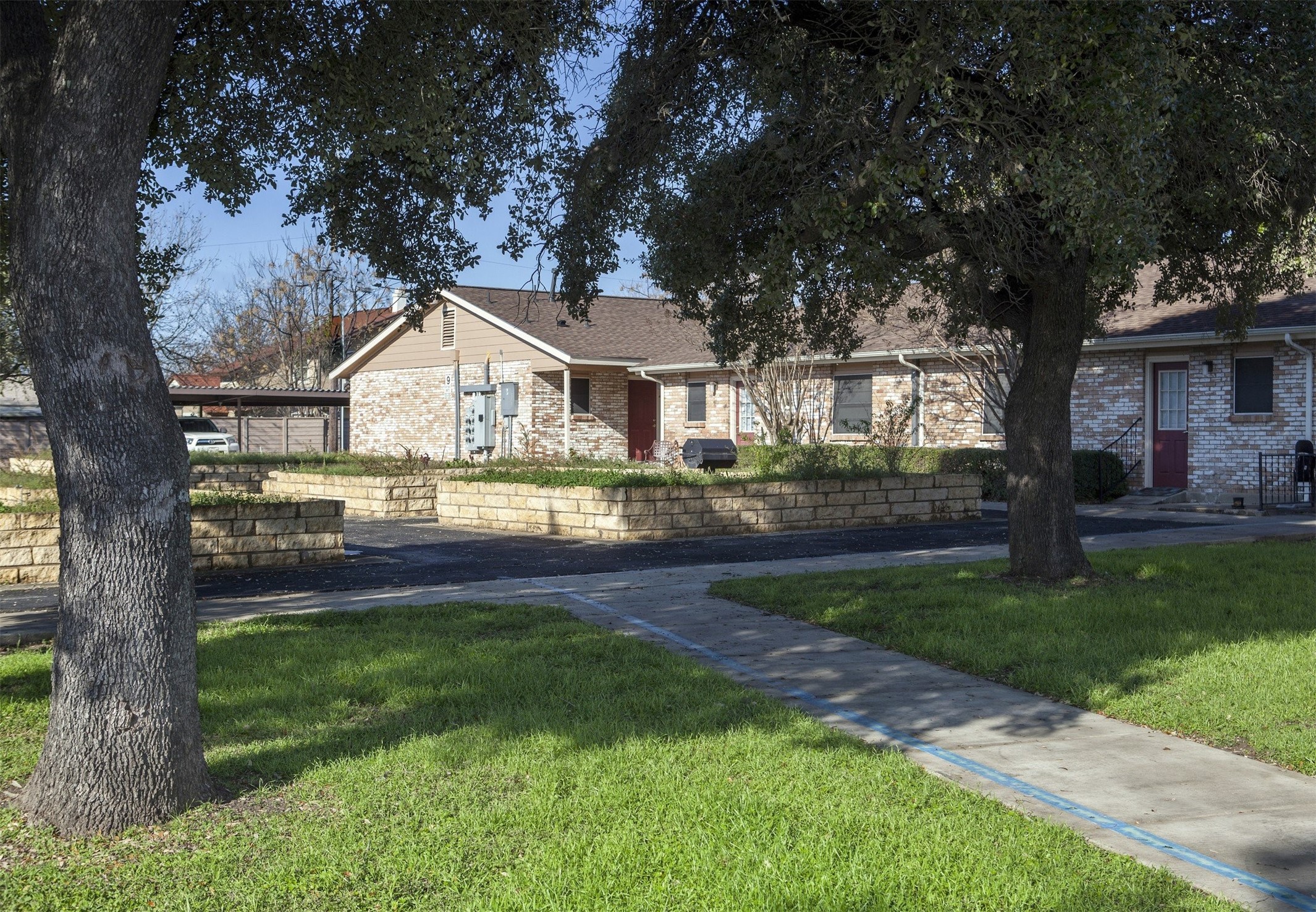8219 Perrin Beitel Road San Antonio, TX 78218 - Photo 2 of 18 front view of a house with a yard