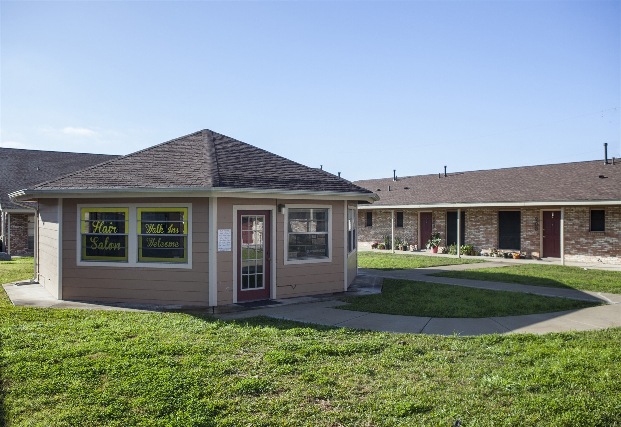 8219 Perrin Beitel Road San Antonio, TX 78218 - Photo 6 of 18 a front view of a house with a garden