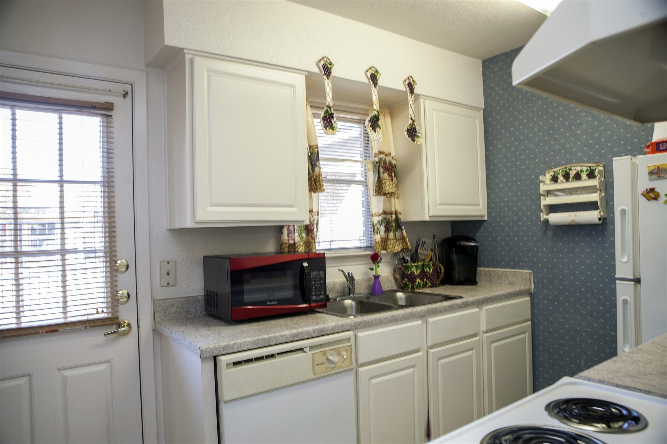 8219 Perrin Beitel Road San Antonio, TX 78218 - Photo 7 of 18 a kitchen with a sink cabinets and a window
