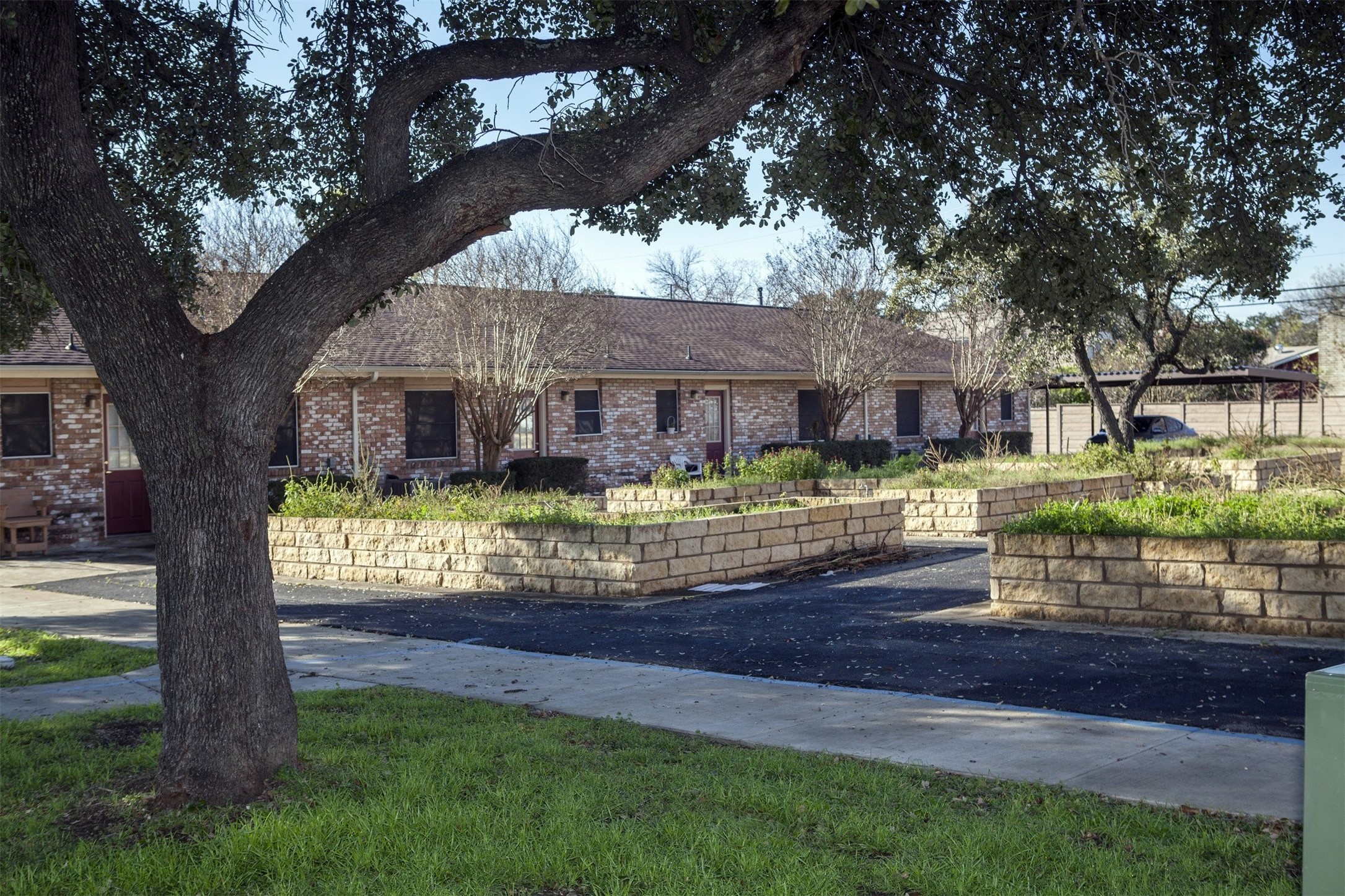 8219 Perrin Beitel Road San Antonio, TX 78218 - Photo 9 of 18 a front view of a house with garden