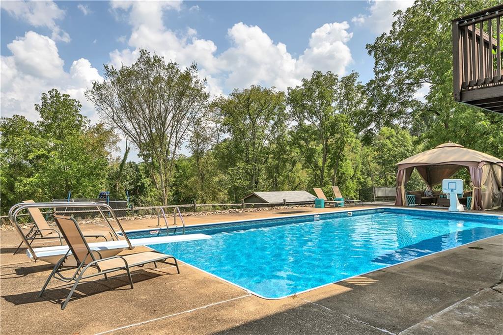 620 Highland Ridge Road Claysville, PA 15323 - Photo 22 of 25 a view of a swimming pool with a lounge chair