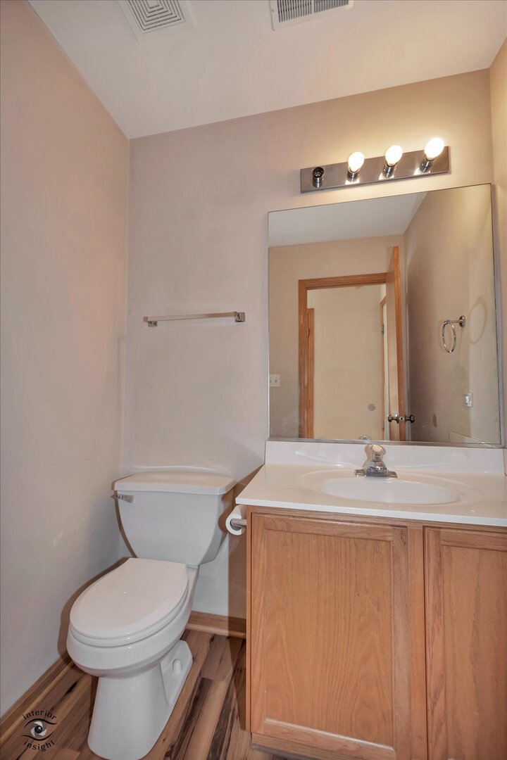 1606 Donegal Drive Minooka, IL 60447 - Photo 19 of 25 a bathroom with a granite countertop toilet sink and mirror