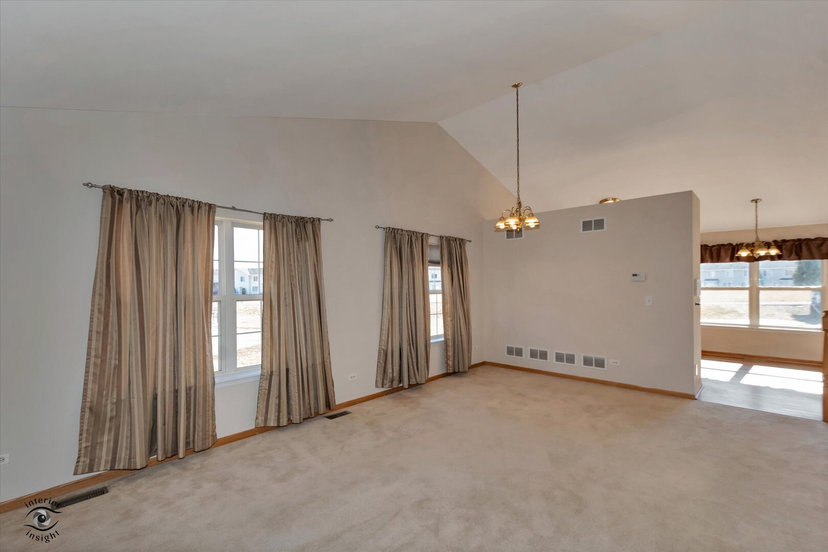 1606 Donegal Drive Minooka, IL 60447 - Photo 4 of 25 en empty room with windows and ceiling fan