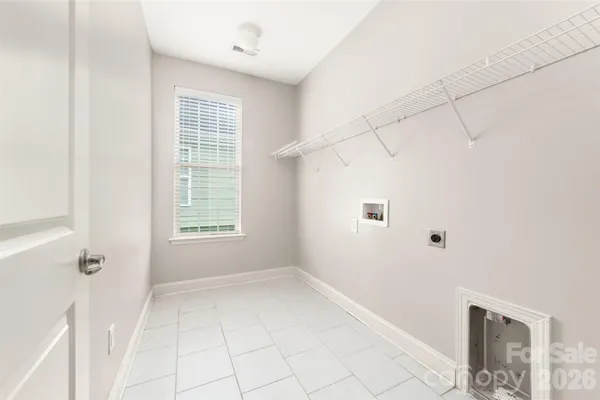 a view of a livingroom with an empty space and a window