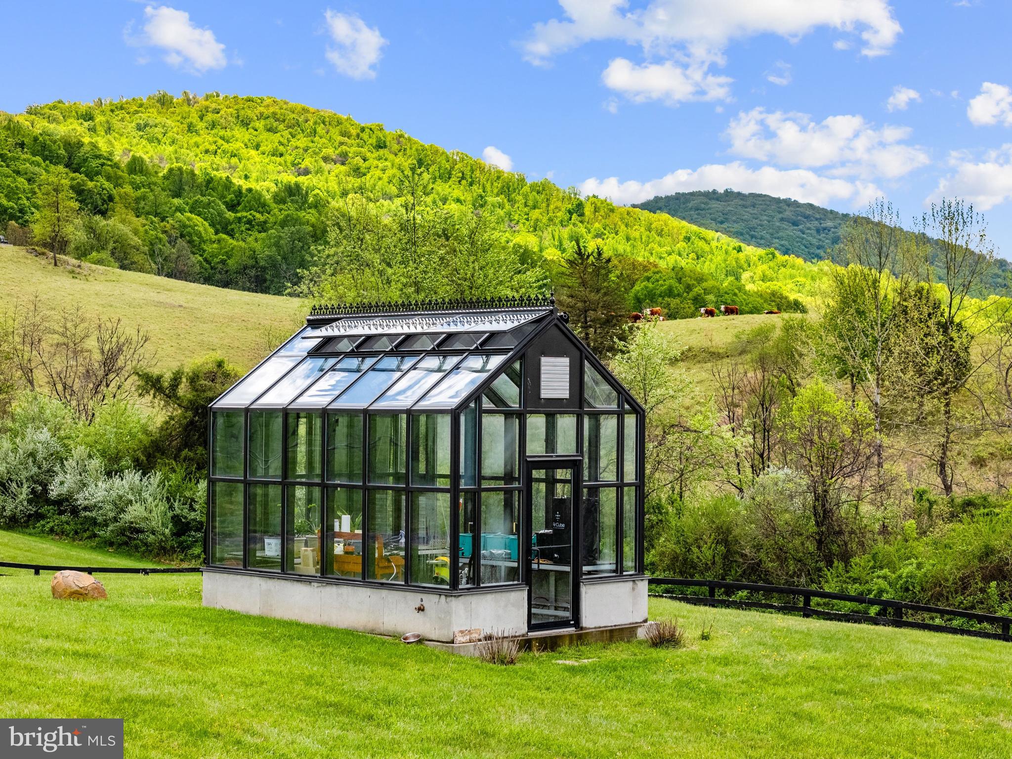 3459 Carrington Road Delaplane, VA 20144 - Photo 105 of 106 a view of a house with a backyard and a patio