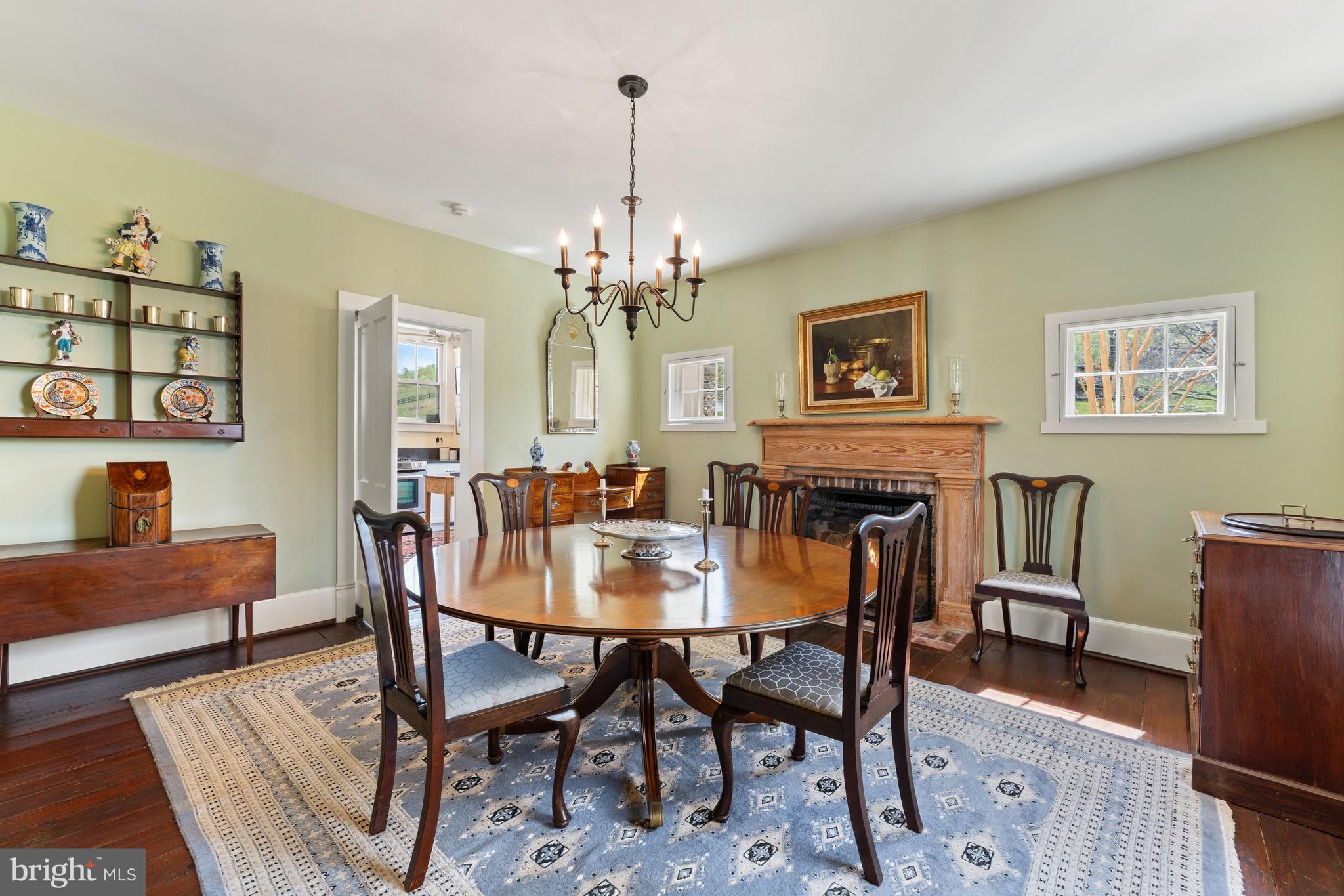 3459 Carrington Road Delaplane, VA 20144 - Photo 12 of 106 a view of a dining room with furniture and chandelier