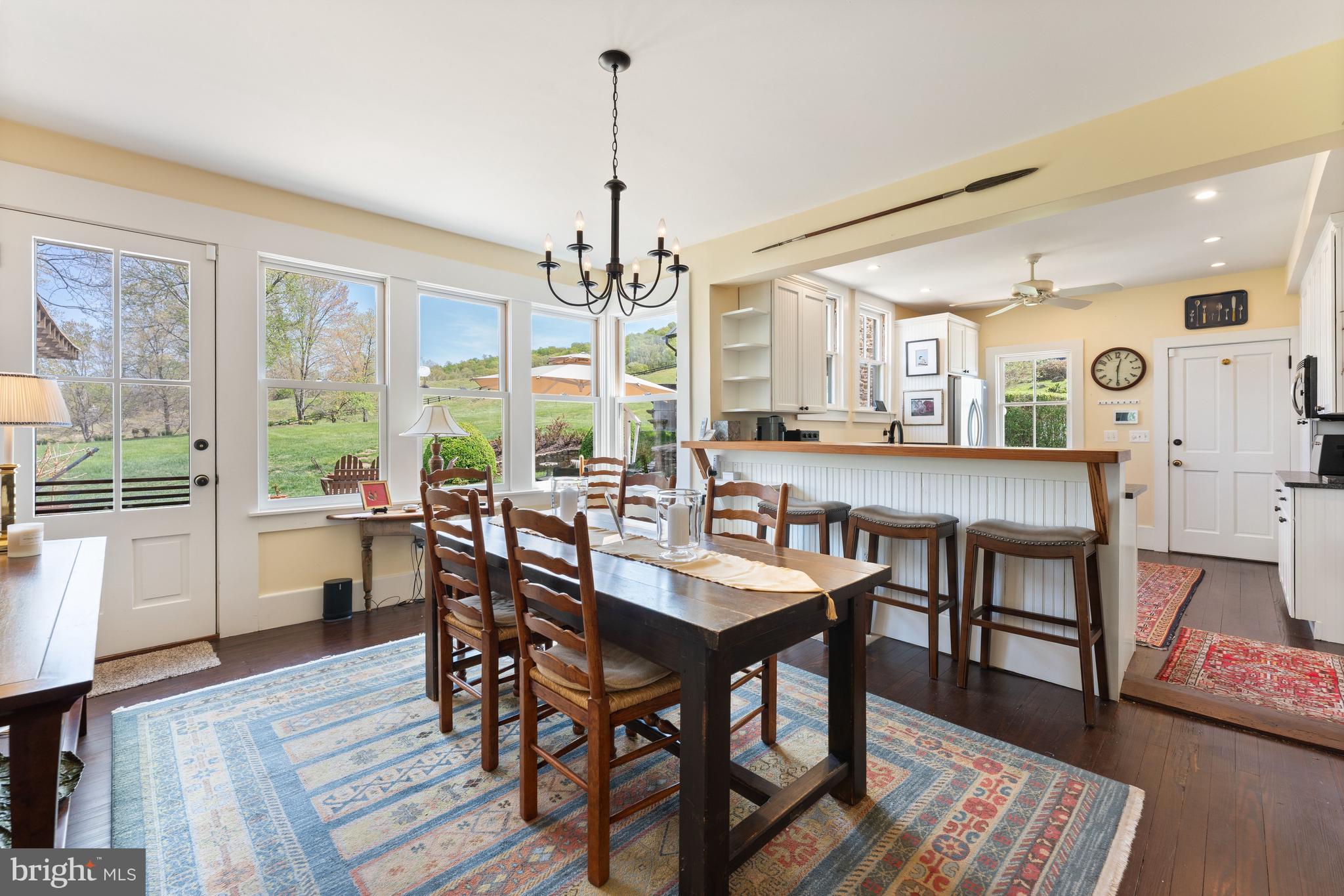 3459 Carrington Road Delaplane, VA 20144 - Photo 18 of 106 a view of a dining room with furniture window and wooden floor