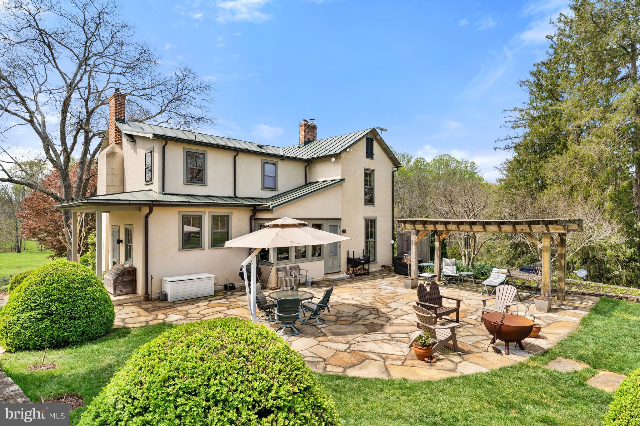 3459 Carrington Road Delaplane, VA 20144 - Photo 42 of 106 a view of a house with backyard porch and sitting area