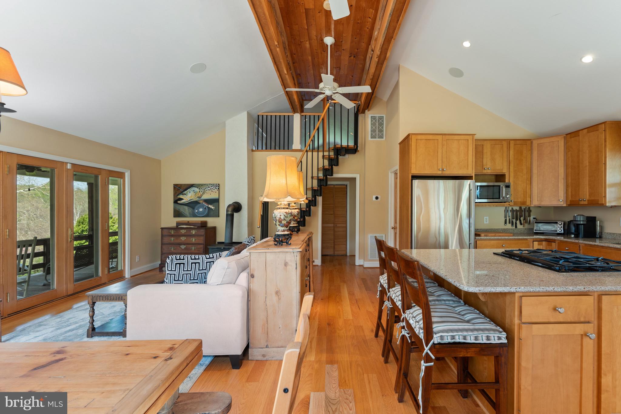 3459 Carrington Road Delaplane, VA 20144 - Photo 51 of 106 a kitchen with stainless steel appliances granite countertop a refrigerator a stove and a wooden floors