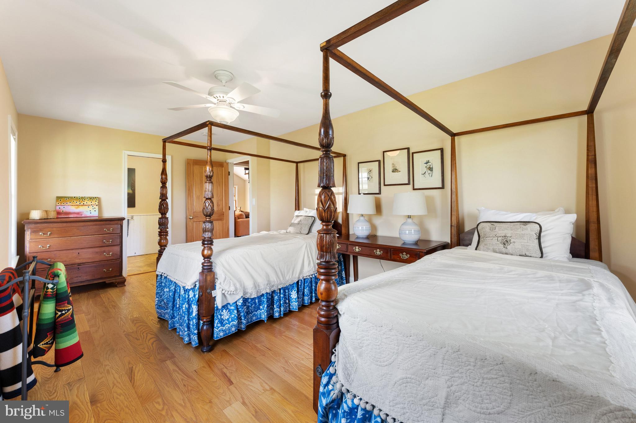 3459 Carrington Road Delaplane, VA 20144 - Photo 61 of 106 a bedroom with bed and a chandelier