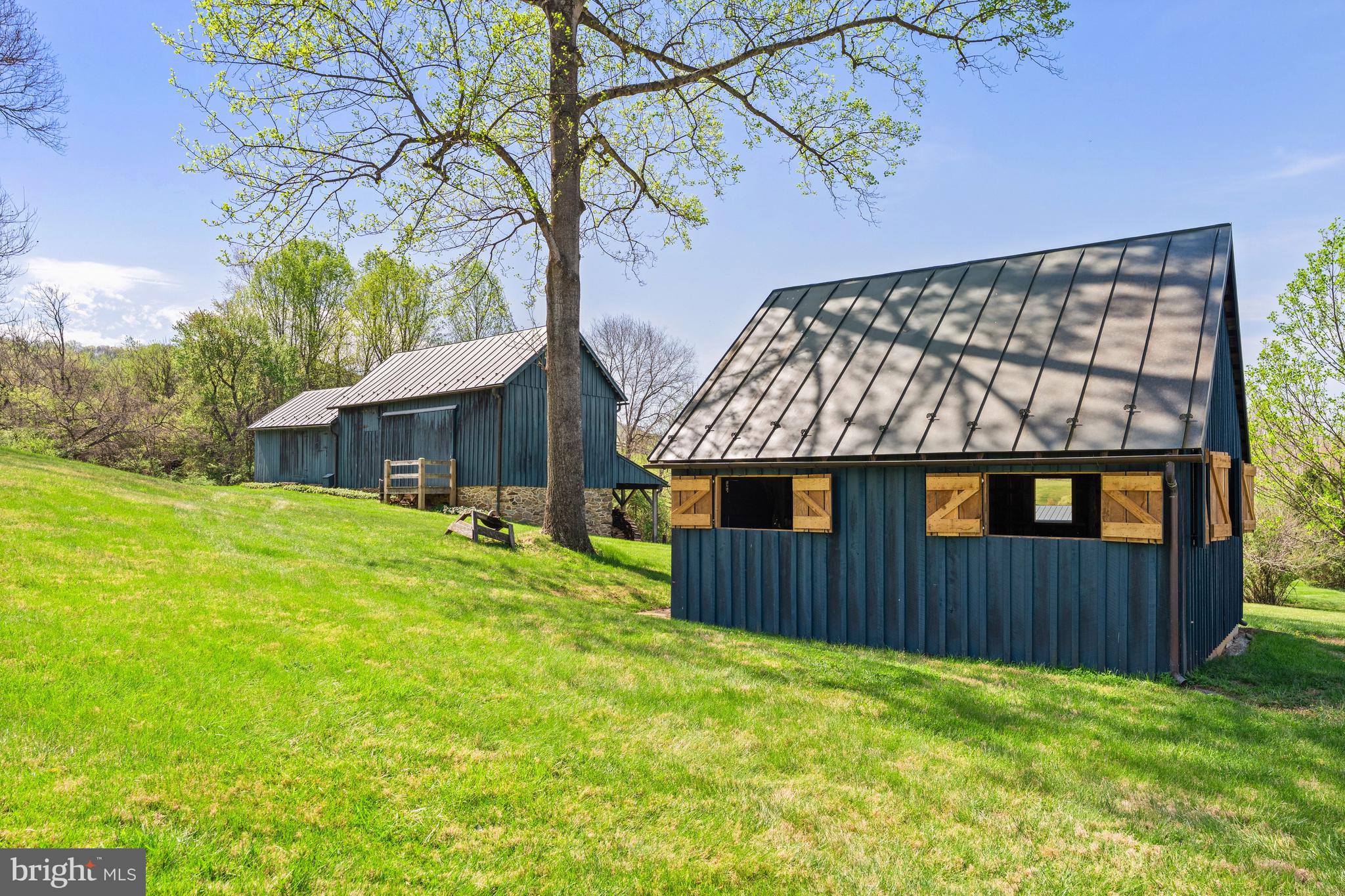 3459 Carrington Road Delaplane, VA 20144 - Photo 73 of 106 a front view of a house with yard patio and wooden fence