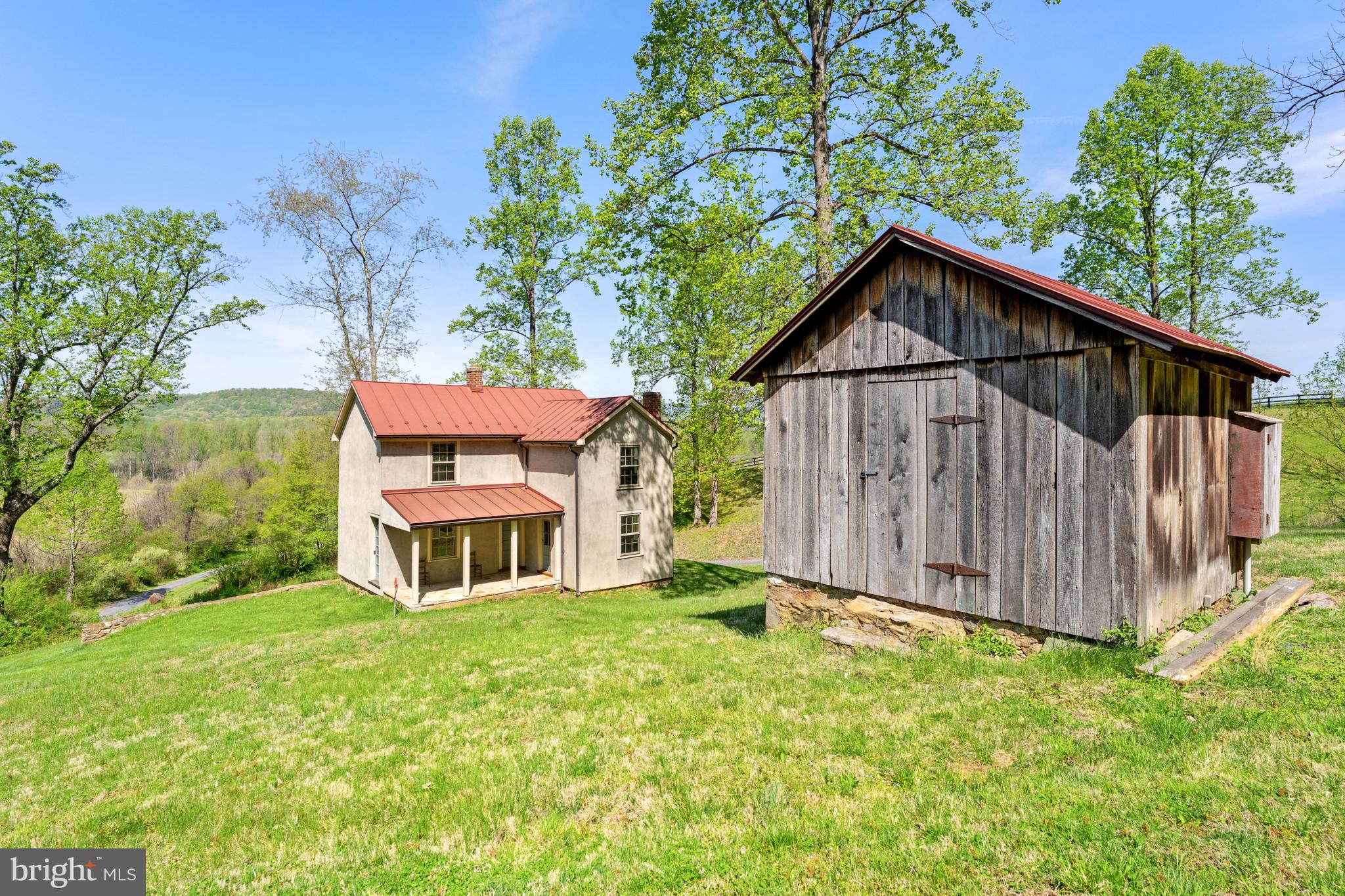 3459 Carrington Road Delaplane, VA 20144 - Photo 82 of 106 a view of a house with a yard plants and large tree