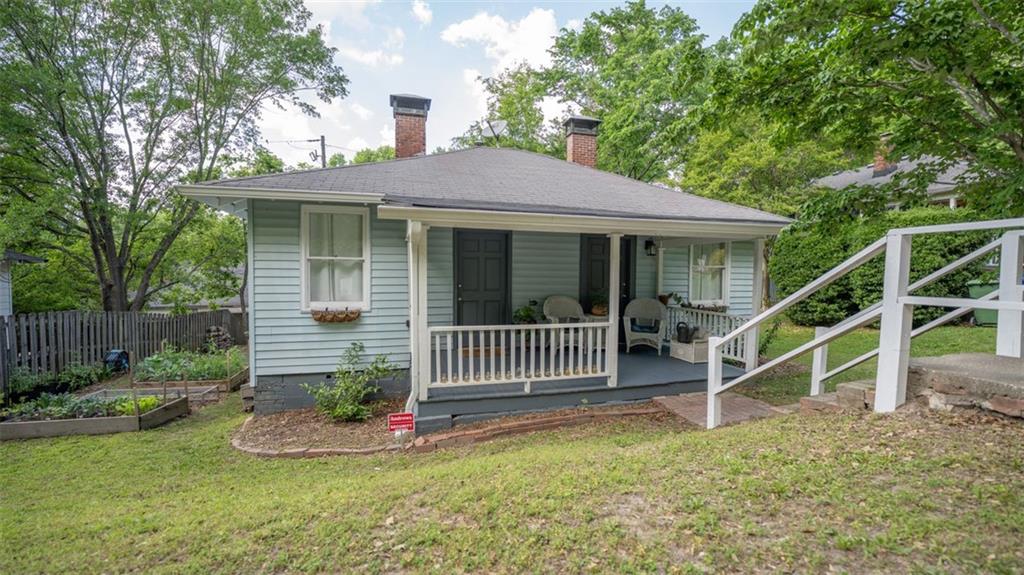 2881 Parrott Avenue Northwest Atlanta, GA 30318 - Photo 1 of 1 a view of house with a yard and a garden