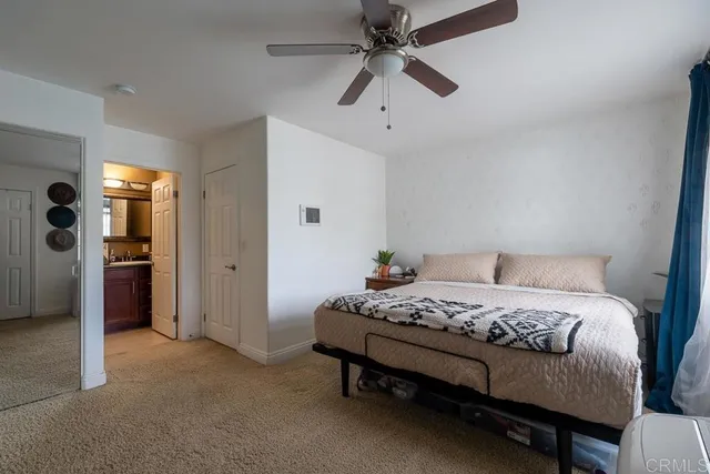 a bedroom with a bed and a television in it
