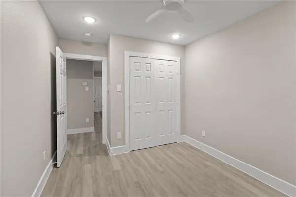a large kitchen with kitchen island a sink stainless steel appliances and cabinets