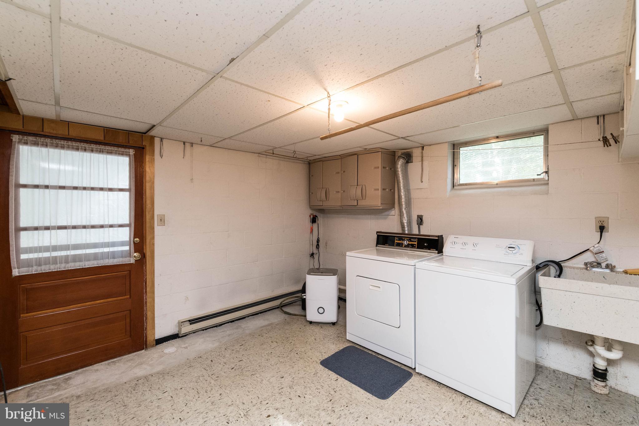 210 Gibson Road Annapolis, MD 21401 - Photo 22 of 30 Large laundry room w/ stairs to rear yard