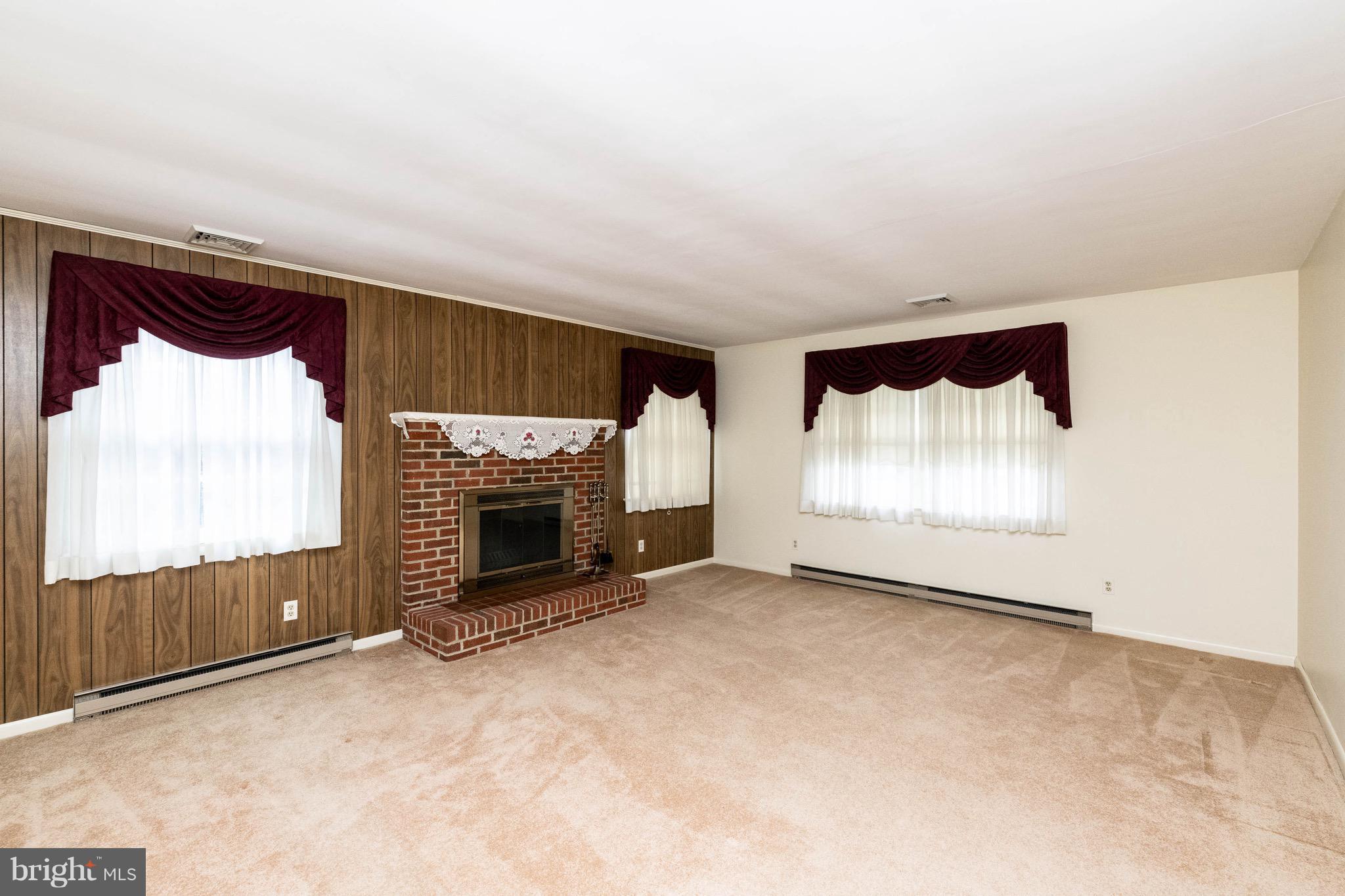 210 Gibson Road Annapolis, MD 21401 - Photo 4 of 30 Living room w/wood burning fireplace