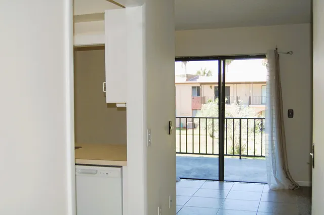 a view of an empty room with a window