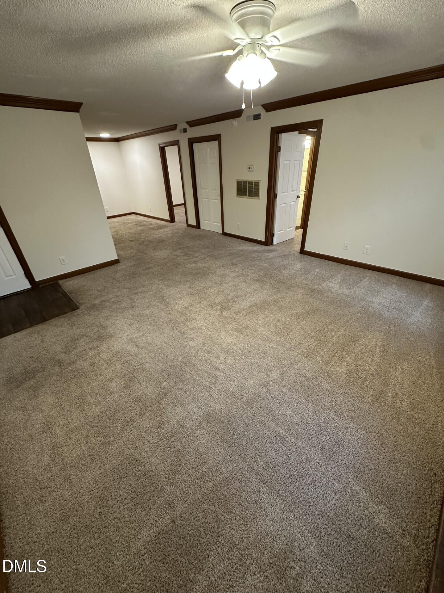 3535 Ivy Commons Drive, Unit 302 Raleigh, NC 27606 - Photo 2 of 9 a view of a livingroom with a fireplace