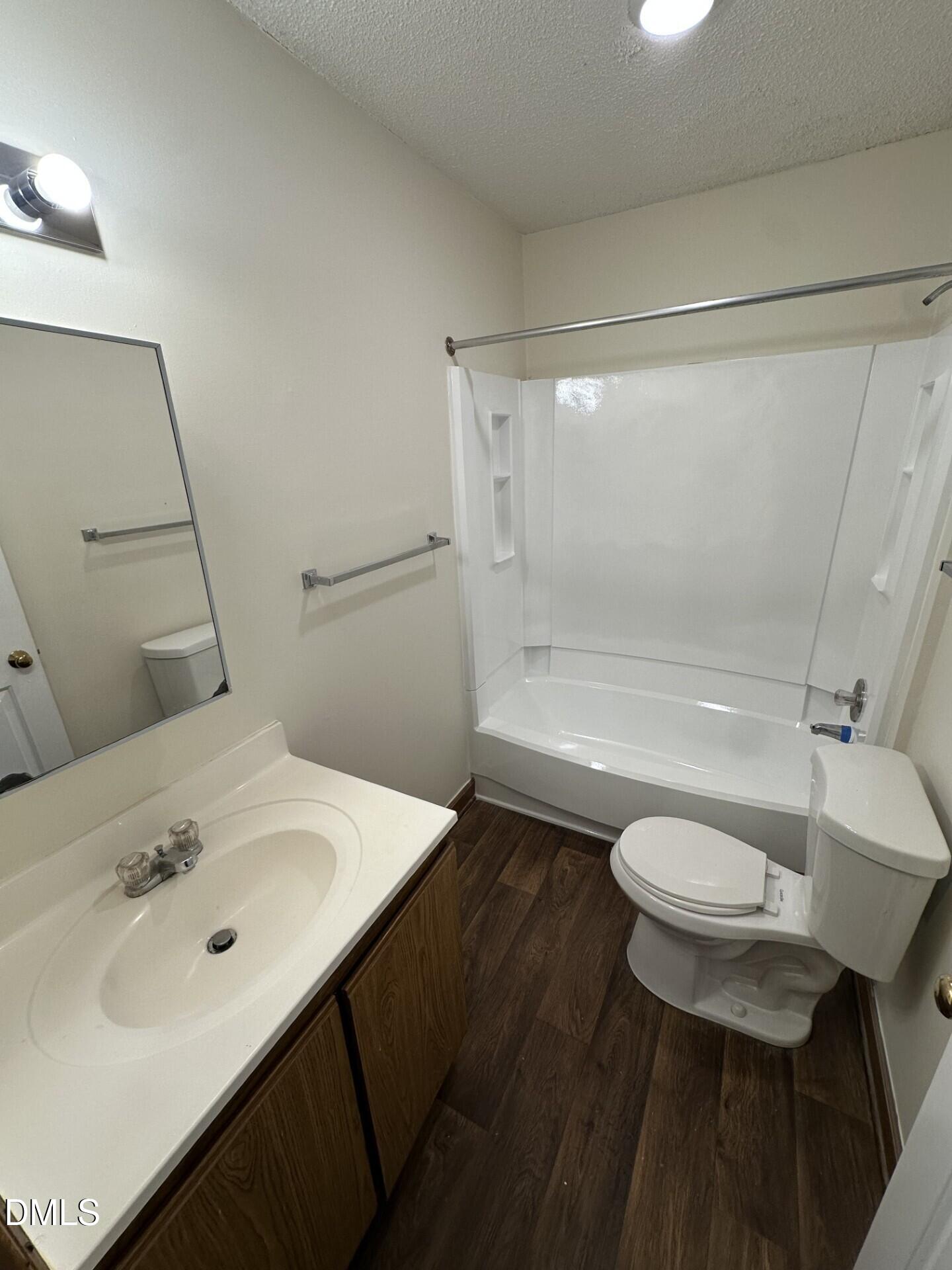 3535 Ivy Commons Drive, Unit 302 Raleigh, NC 27606 - Photo 7 of 9 a bathroom with a sink toilet and shower