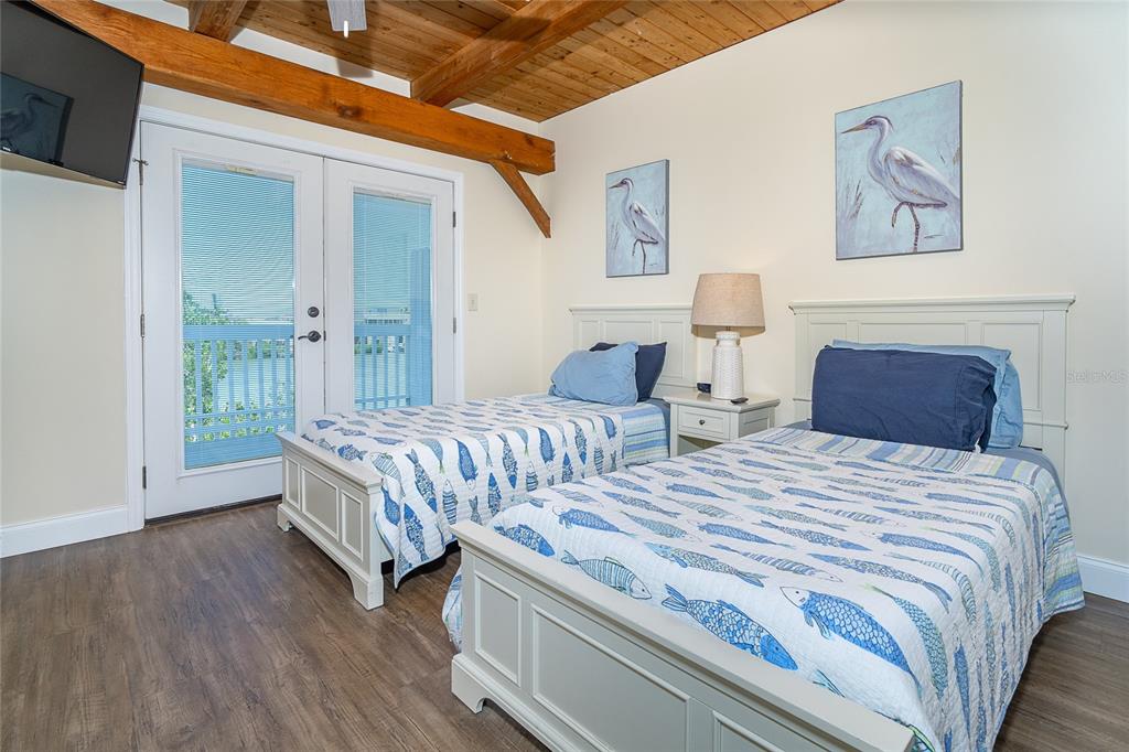 360 South Gulf Boulevard Boca Grande, FL 33921 - Photo 15 of 64 a bedroom with bed and a window