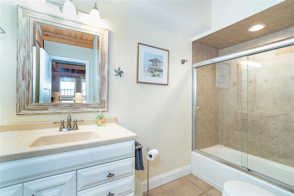 360 South Gulf Boulevard Boca Grande, FL 33921 - Photo 16 of 64 a bathroom with a sink a toilet and shower