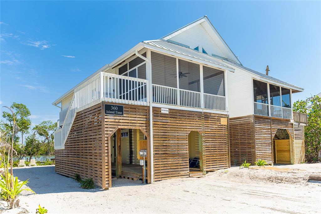 360 South Gulf Boulevard Boca Grande, FL 33921 - Photo 2 of 64 a front view of a house