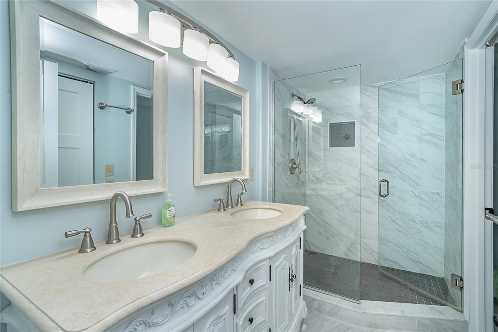 360 South Gulf Boulevard Boca Grande, FL 33921 - Photo 24 of 64 a bathroom with a granite countertop sink mirror and double