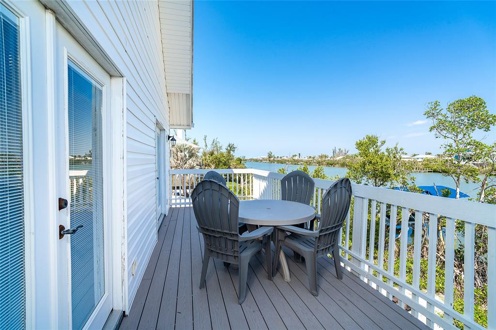 360 South Gulf Boulevard Boca Grande, FL 33921 - Photo 25 of 64 a view of a dining room with furniture and wooden floor