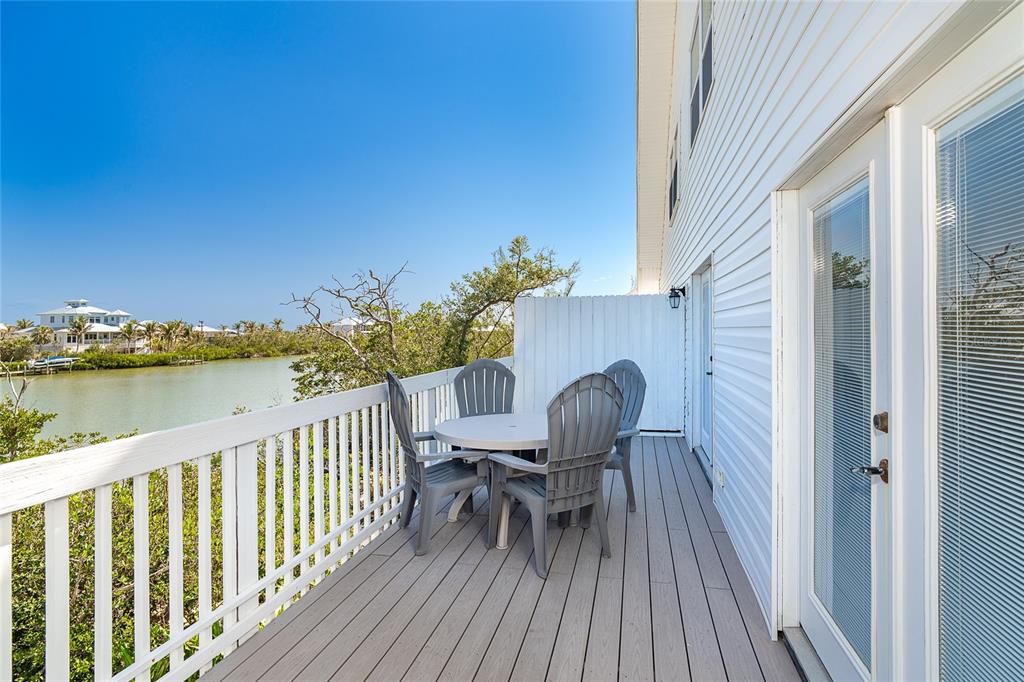 360 South Gulf Boulevard Boca Grande, FL 33921 - Photo 27 of 64 a view of balcony with furniture and wooden floor