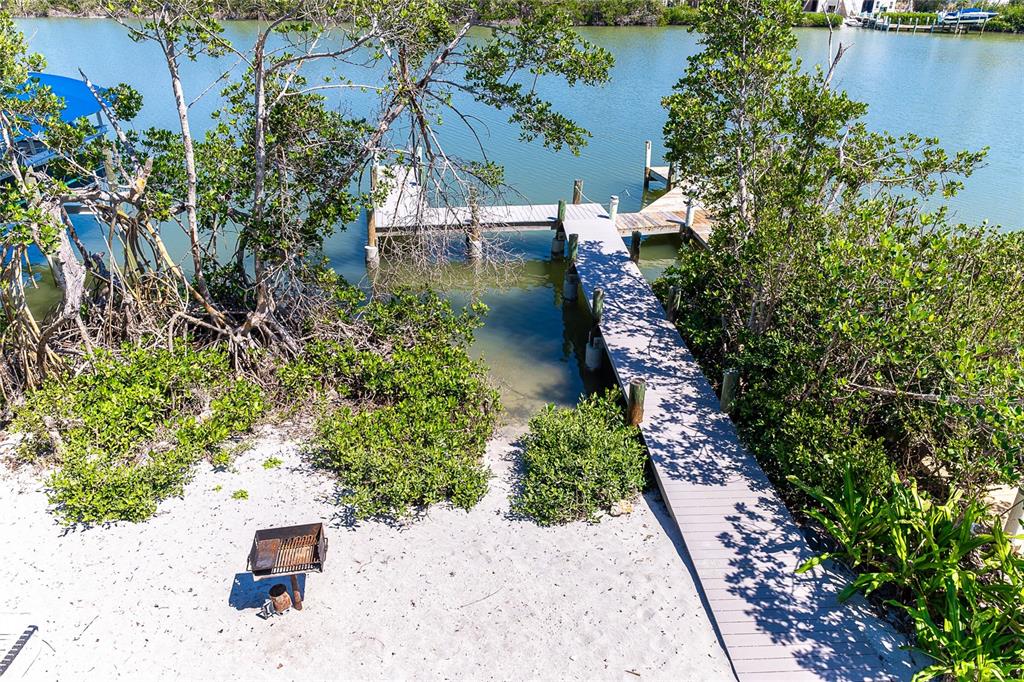 360 South Gulf Boulevard Boca Grande, FL 33921 - Photo 28 of 64 an aerial view of a house with a yard and lake view