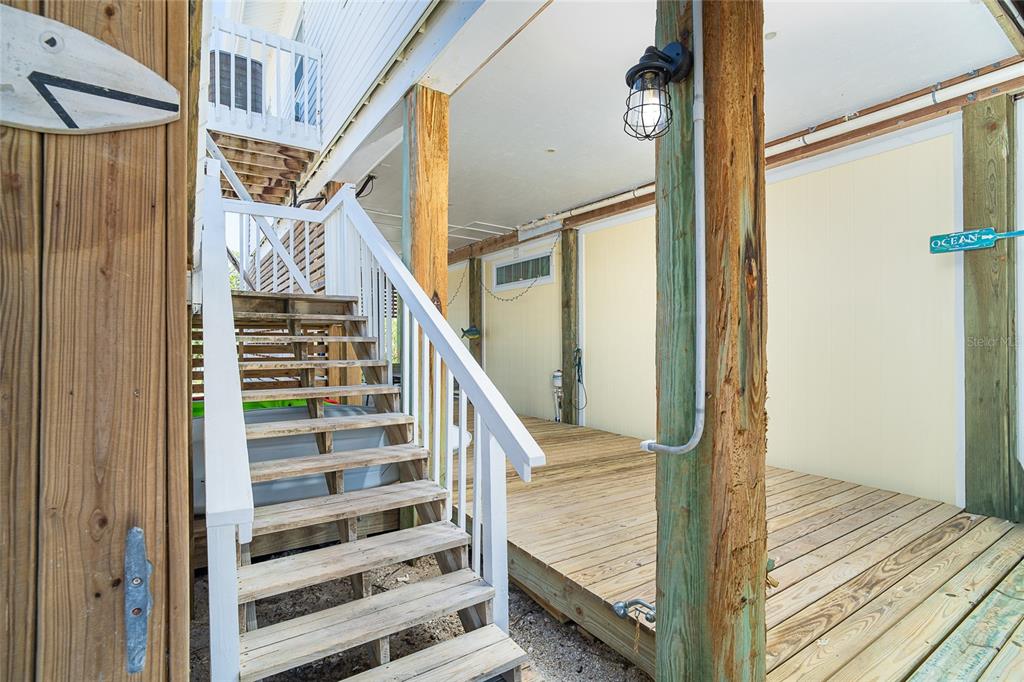 360 South Gulf Boulevard Boca Grande, FL 33921 - Photo 3 of 64 a view of a hallway with wooden floor and staircase