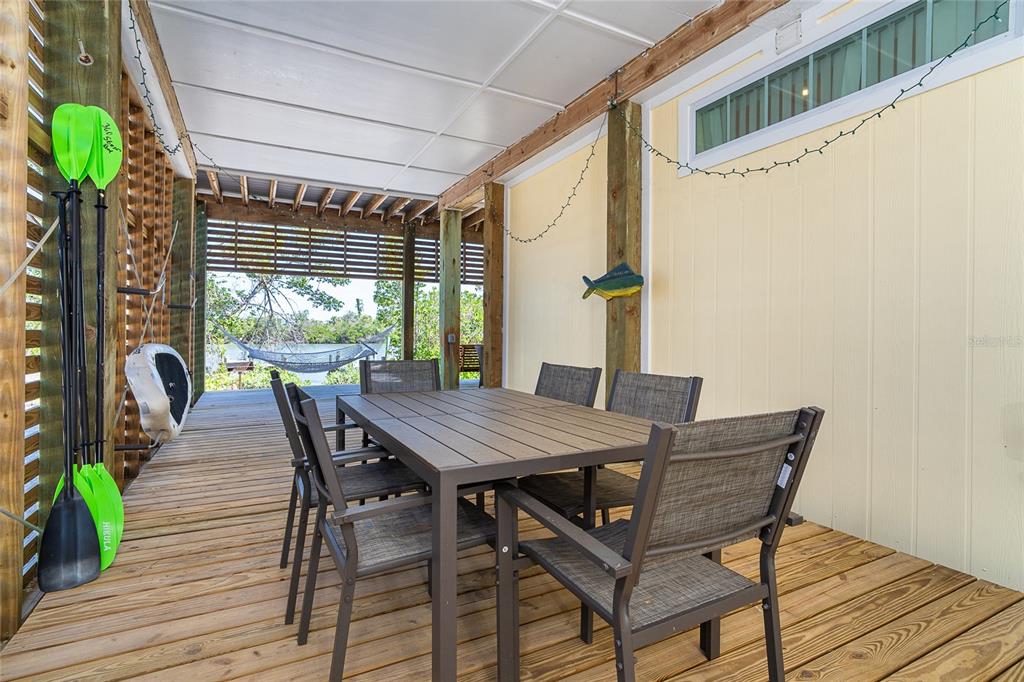 360 South Gulf Boulevard Boca Grande, FL 33921 - Photo 31 of 64 a view of a patio with a table and chairs